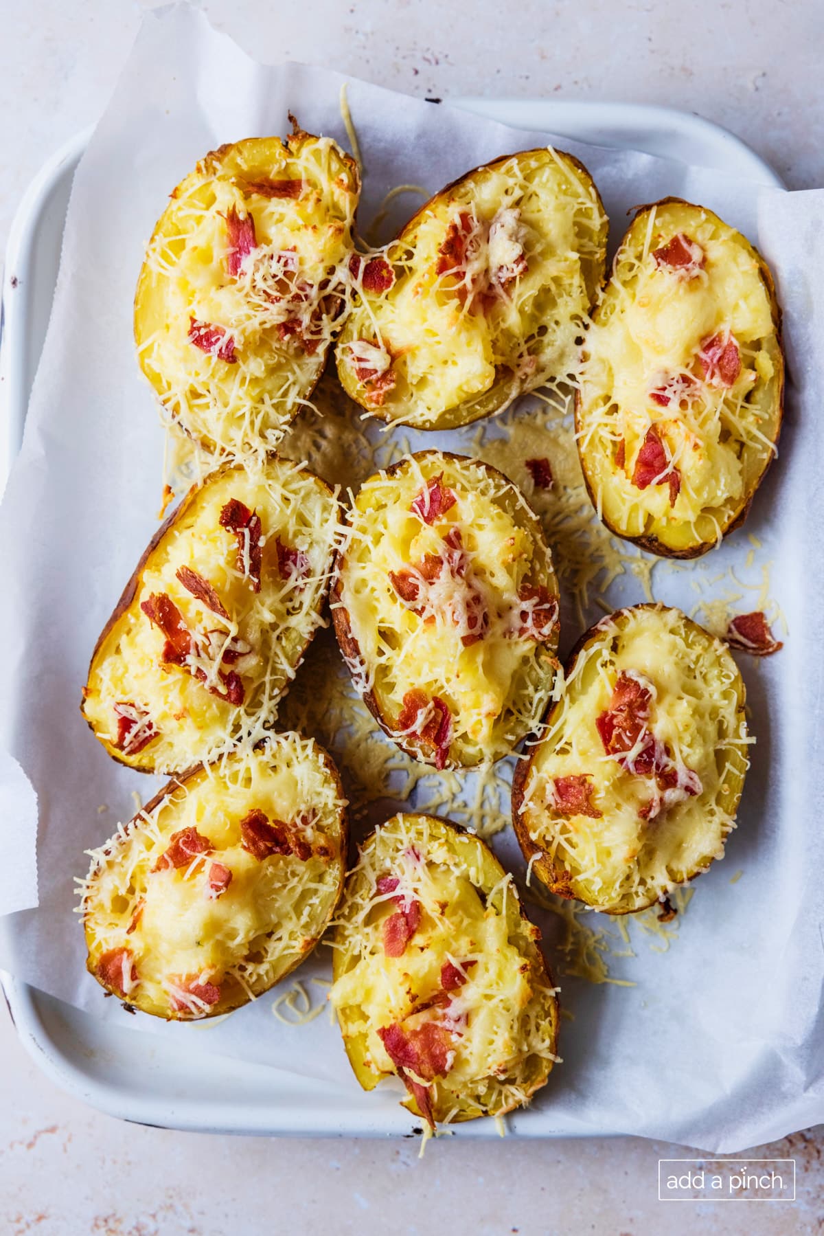 Photo of twice baked potatoes on a white platter.