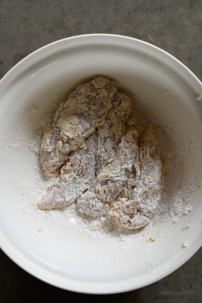 Air Fryer Chicken Tenders Recipe - These crispy, tender and delicious chicken fingers are baked to perfection in the air fryer. // addapinch.com