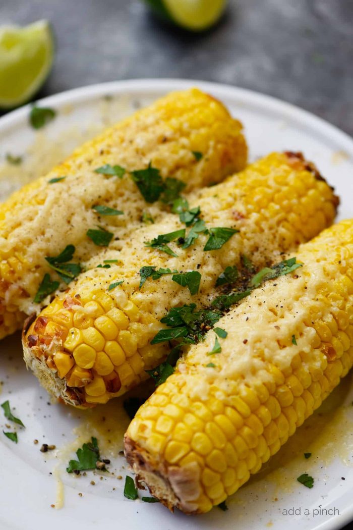 Air Fryer Mexican Street Corn Recipe - This flavorful, super easy Mexican Street Corn recipe is ready in 15 minutes in the air fryer and always a favorite! // addapinch.com