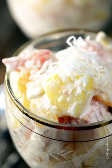 Southern Ambrosia makes makes a classic holiday fruit salad loaded with citrus fruits. A sweet and creamy salad, ambrosia is always a favorite! // addapinch.com