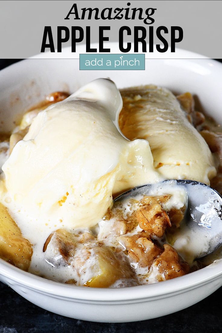 Bowl of Apple Crisp topped with vanilla ice cream - with text - addapinch.com