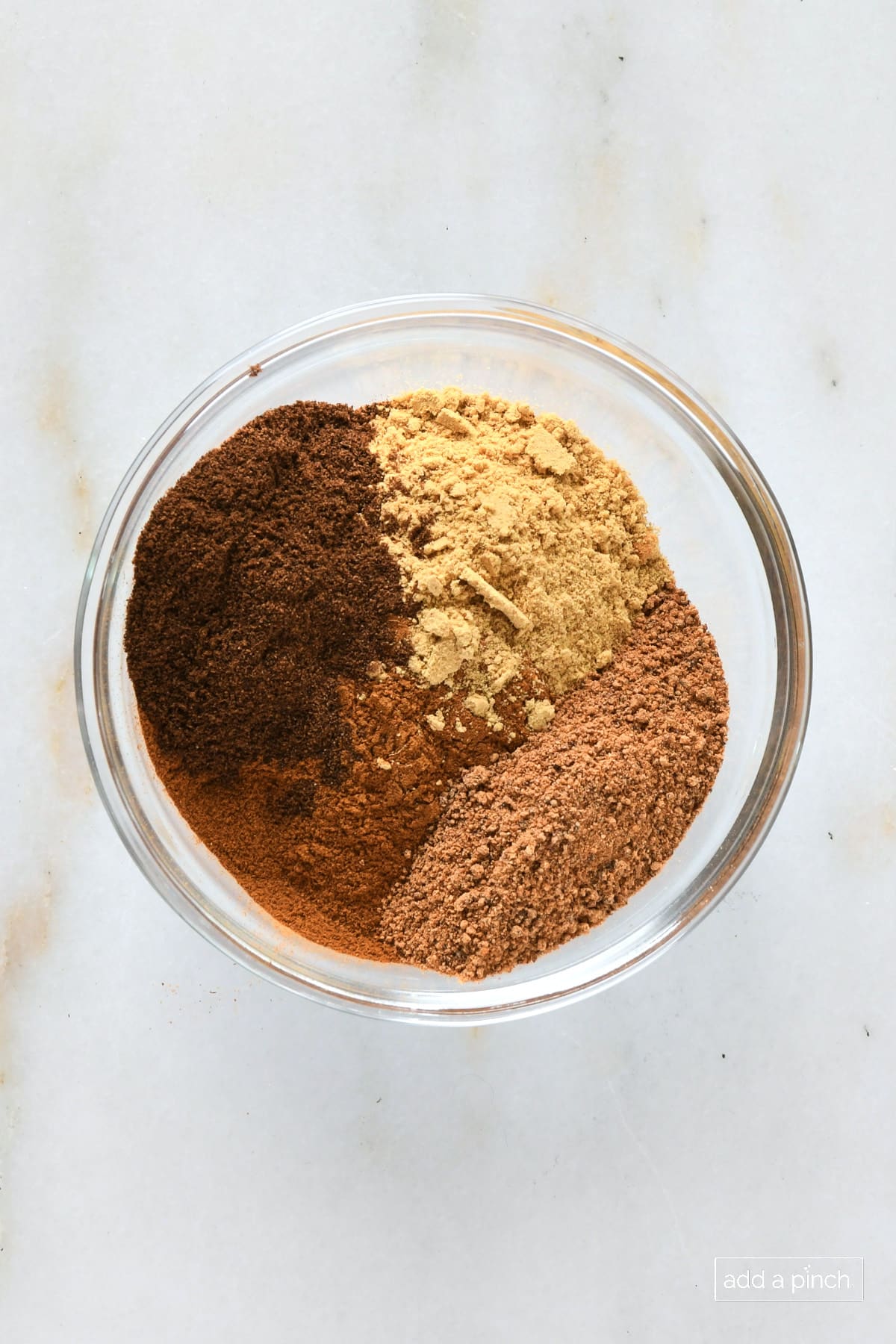 Large bowl with ginger, cinnamon, allspice and nutmeg.