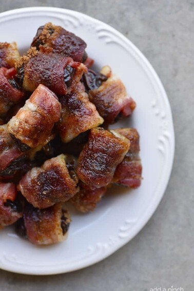 Bacon Wrapped Dates Recipe - These 5-ingredient bacon wrapped dates are out of this world delicious and so easy! // addapinch.com