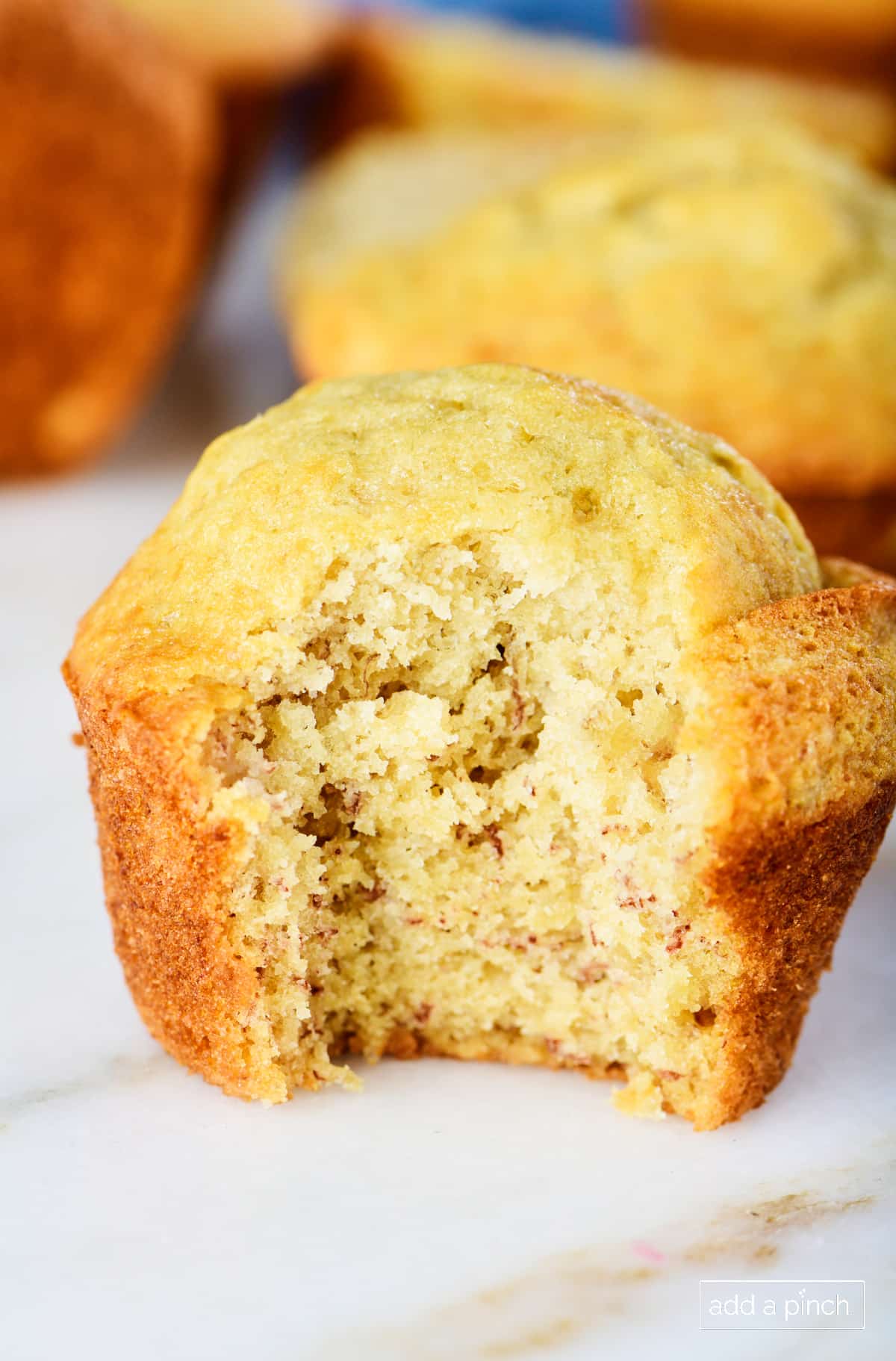 Photo of best banana bread muffin on a marble surface