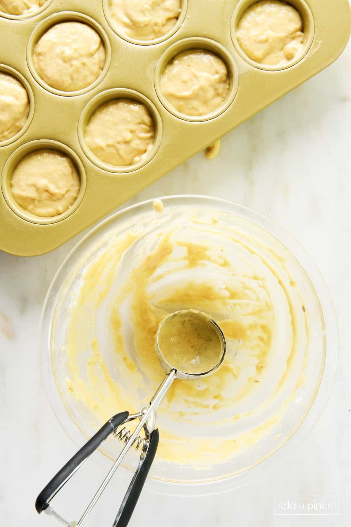 Banana muffin batter divided among 12-cup muffin pan