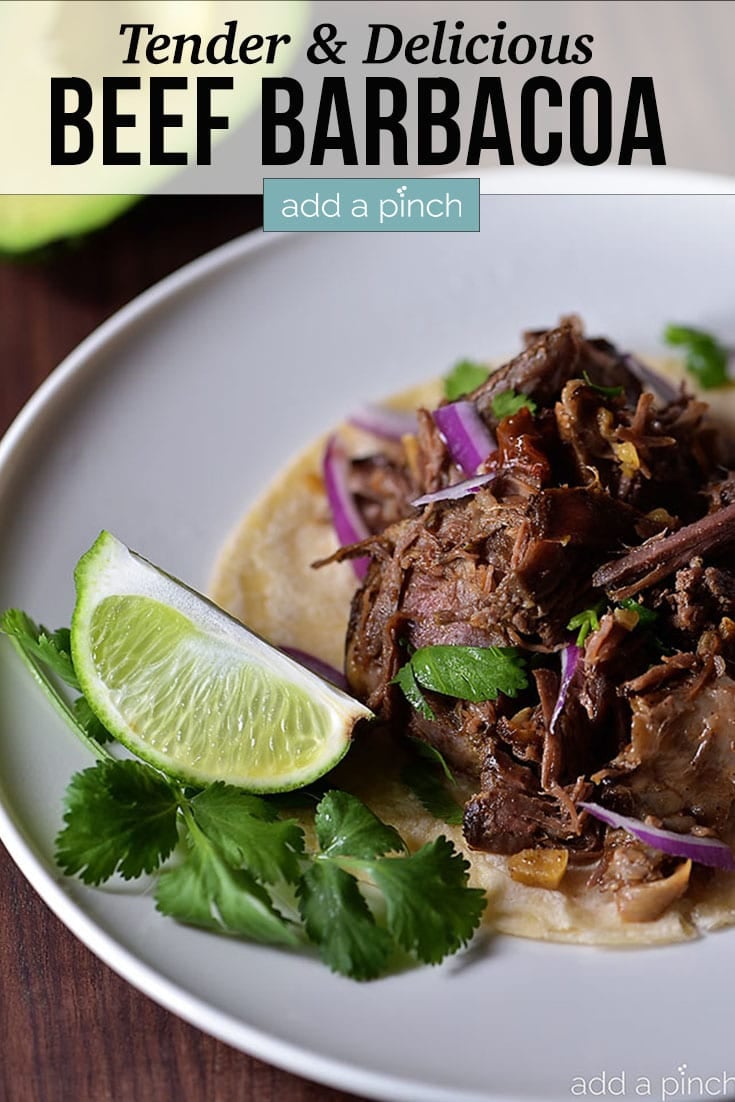Beef Barbacoa on tortilla with slice of lime and text - addapinch.com