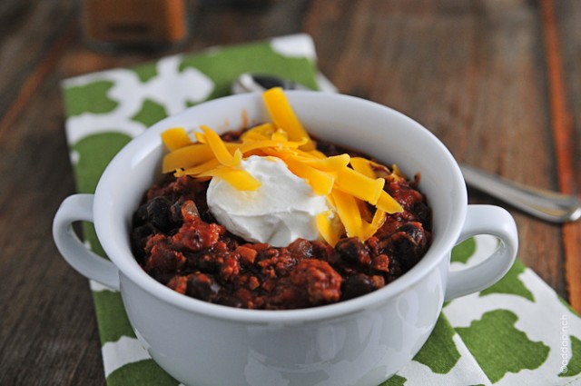 Black Bean Chili Recipe - Black Bean Chili is perfect for a quick-fix weeknight supper. Ready in 30 minutes, this chili is full of ground beef, black beans, and tons of flavor! // addapinch.com