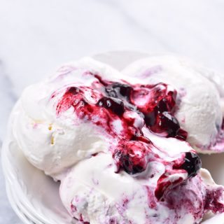 Blueberry Cheesecake Ice Cream Recipe - This Blueberry Cheesecake Ice Cream recipe makes an easy and delicious dessert recipe! A family favorite, this includes a churn and a no-churn ice cream recipe method! // addapinch.com