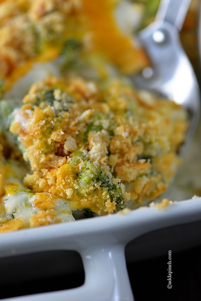 Closeup photo of Broccoli Cheese Casserole in white baking dish
