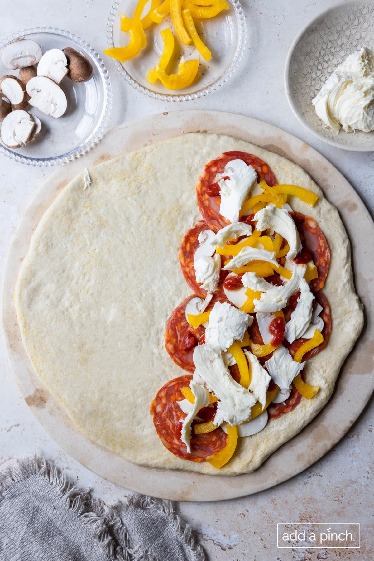 Large calzone with pepperoni, mushrooms, and peppers for filling.