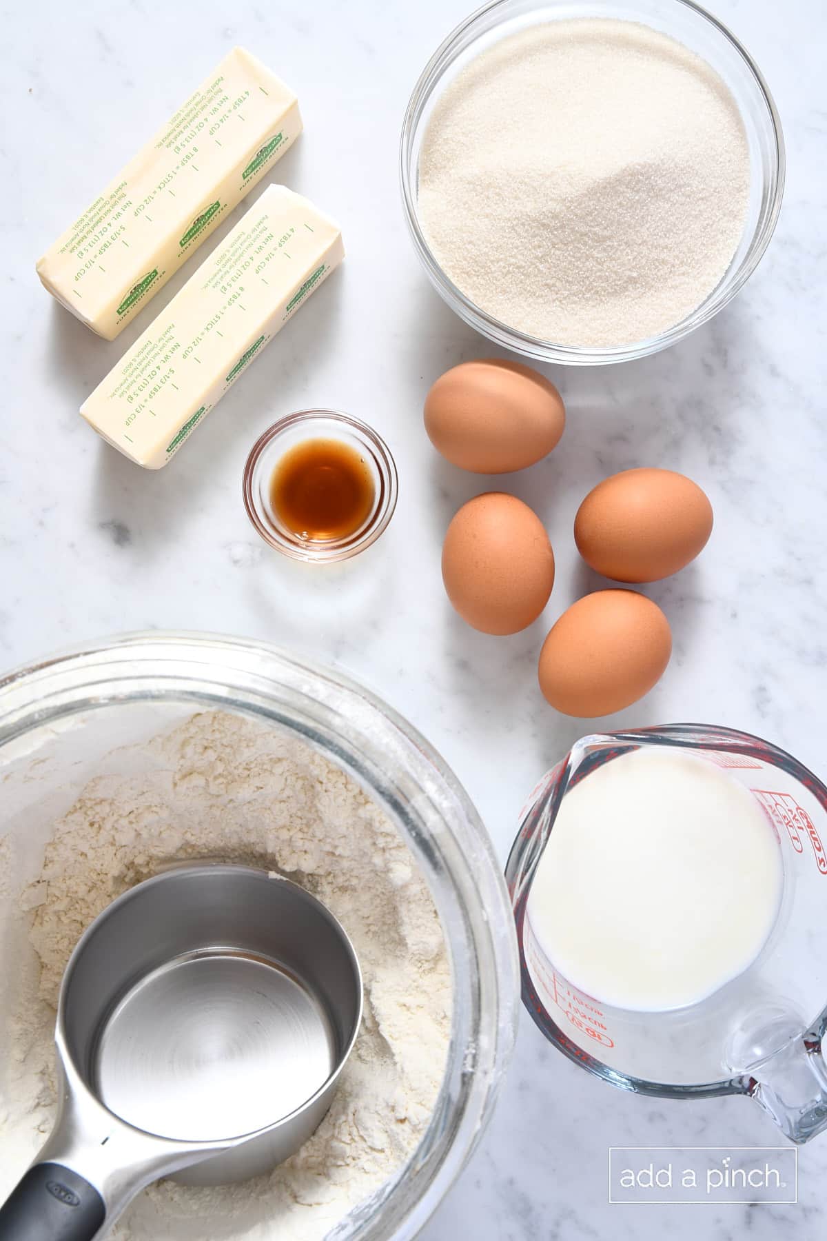 Ingredients used to make southern caramel cake on a marble counter.