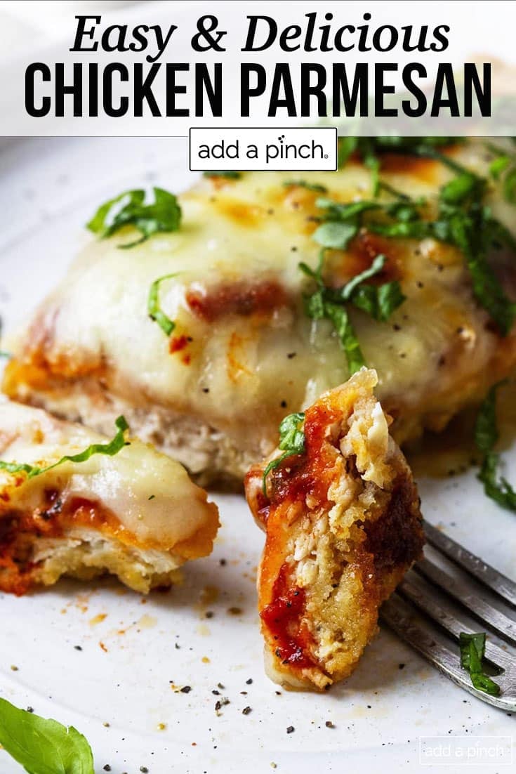 Chicken parmesan recipe on white plate with chicken breast covered in melty parmesan cheese and marinara -with text - addapinch.com