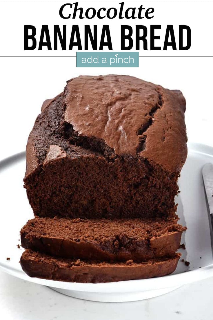 Loaf of Chocolate Banana Bread with slices cut - with text - addapinch.com