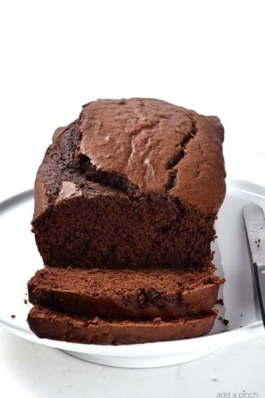Chocolate Banana Bread Recipe - Take your banana bread to a whole new level with this incredibly most and delicious chocolate banana bread recipe! A definite family favorite! // addapinch.com