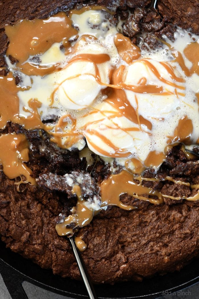 Double Chocolate Caramel Skillet Cookie Recipe - This scrumptious chocolate cookie recipe brings together the richness of chocolate and creamy caramel all in one delicious skillet recipe! // addapinch.comDouble Chocolate Caramel Skillet Cookie Recipe - This scrumptious chocolate cookie recipe brings together the richness of chocolate and creamy caramel all in one delicious skillet recipe! // addapinch.com