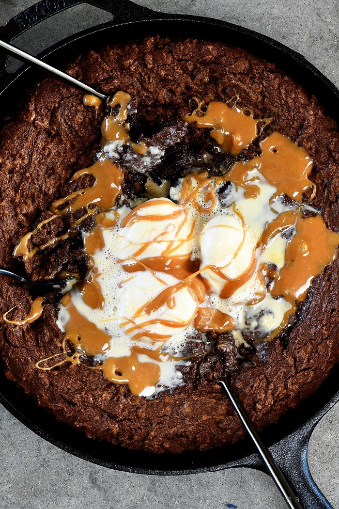 Double Chocolate Caramel Skillet Cookie Recipe - This scrumptious chocolate cookie recipe brings together the richness of chocolate and creamy caramel all in one delicious skillet recipe! // addapinch.com