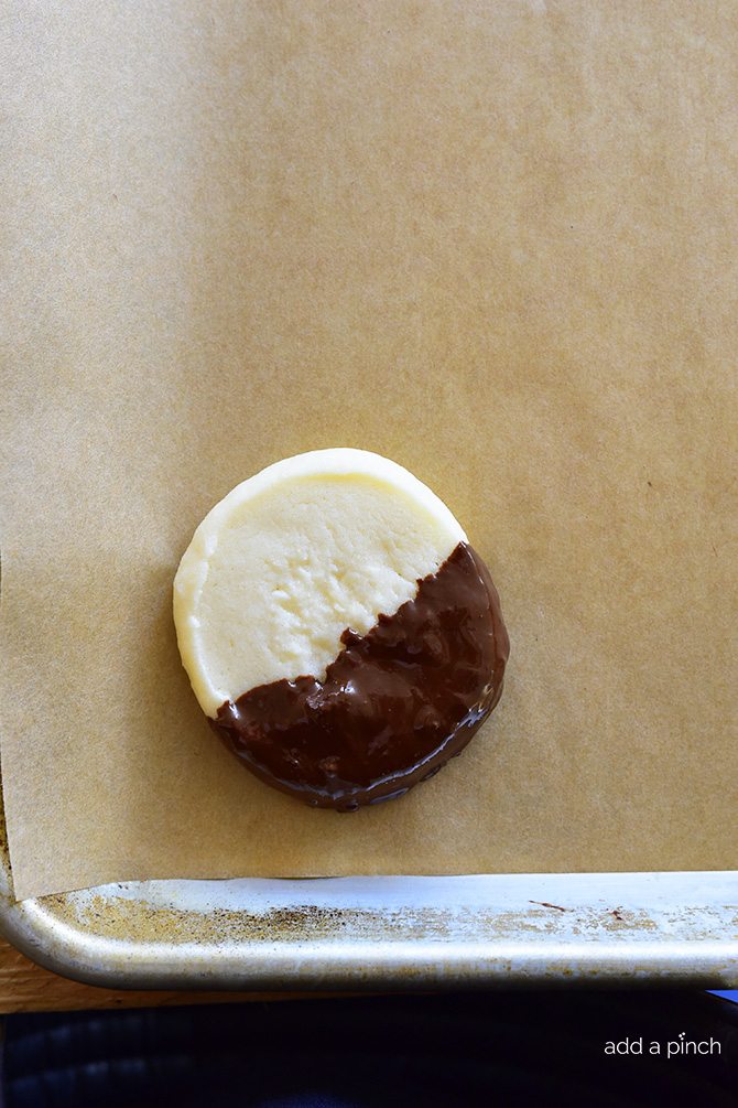 Chocolate Dipped Shortbread Cookies Recipe make a festive and delicious cookie recipe that chocolate lovers adore! Perfect for a make ahead cookie recipe! // addapinch.com