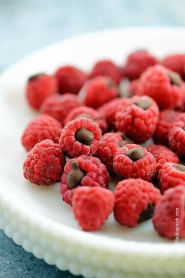 Chocolate Filled Raspberries on a white plate.