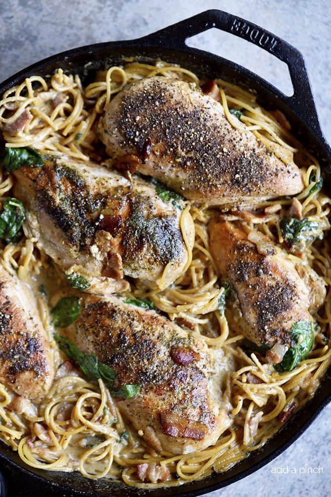 This Creamy Bacon Ranch Chicken Pasta recipe is a quick and easy recipe where everything cooks in one skillet! A family weeknight favorite! // addapinch.com