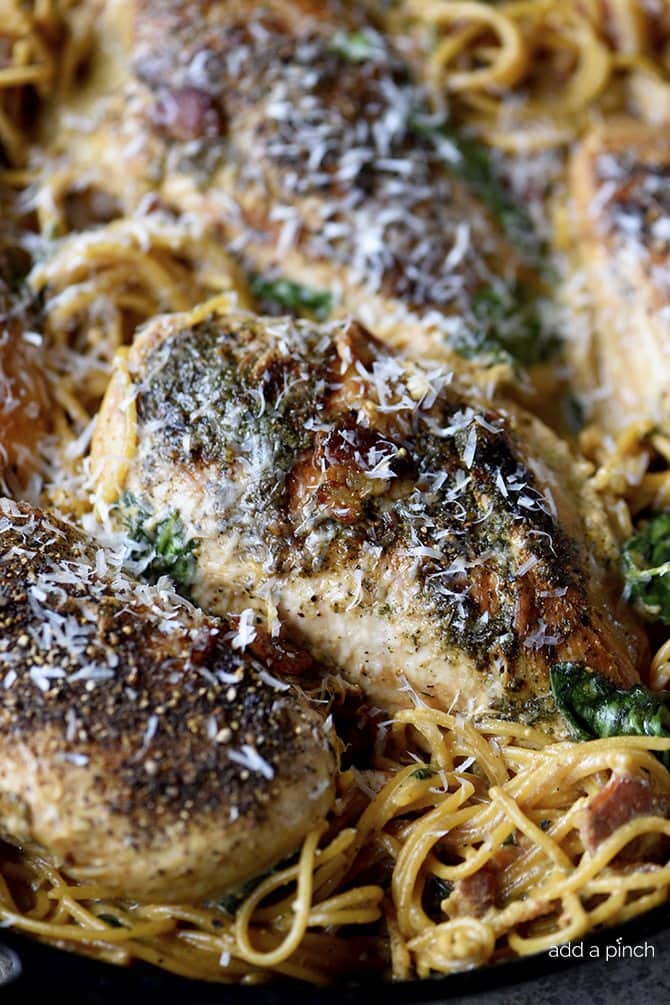 This Creamy Bacon Ranch Chicken Pasta recipe is a quick and easy recipe where everything cooks in one skillet! A family weeknight favorite! // addapinch.com
