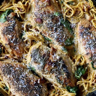 This Creamy Bacon Ranch Chicken Pasta recipe is a quick and easy recipe where everything cooks in one skillet! A family weeknight favorite! // addapinch.com