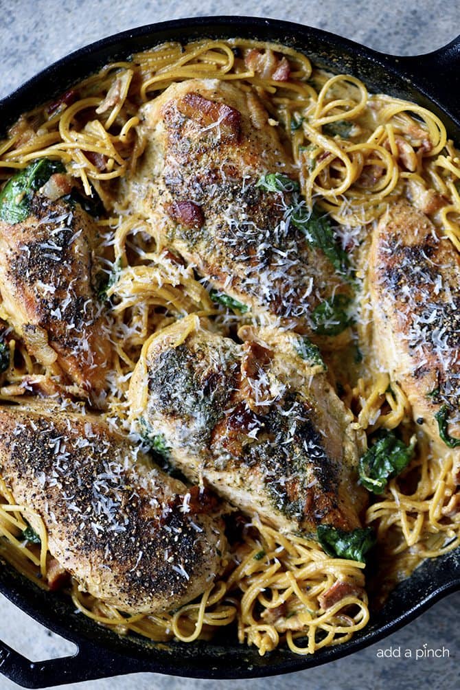 This Creamy Bacon Ranch Chicken Pasta recipe is a quick and easy recipe where everything cooks in one skillet! A family weeknight favorite! // addapinch.com