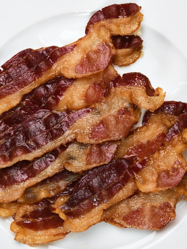 Photo of bacon on a white plate.