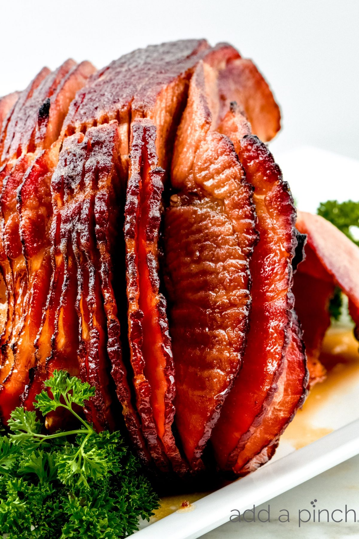 Cola Glazed Ham Recipe - This classic cola glazed ham recipe with brown sugar makes an easy baked ham perfect for any occasion.