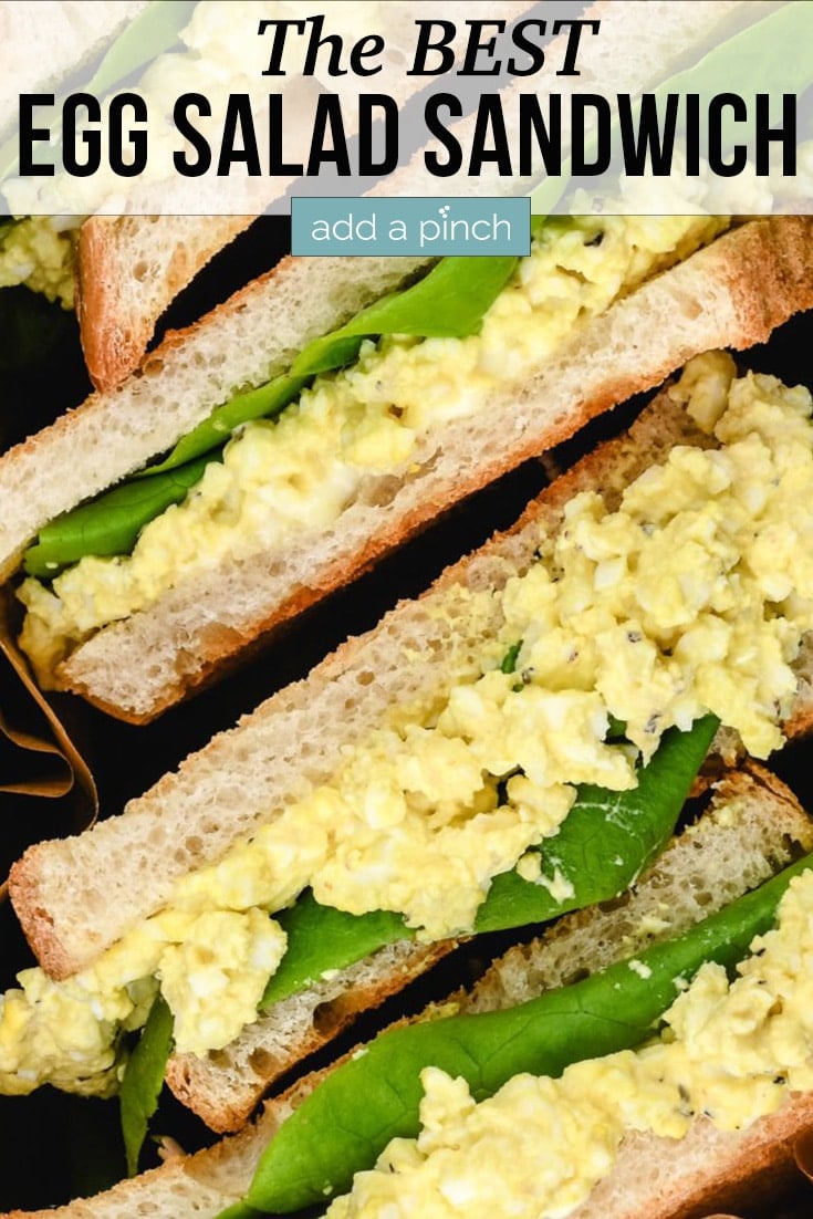 Stack of Egg Salad Sandwiches cut in half - with text - addapinch.com