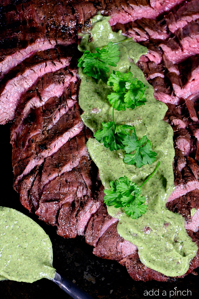 Grilled Flank Steak Recipe served with a chimichurri sauce, this flank steak is a definite favorite! // addapinch.com