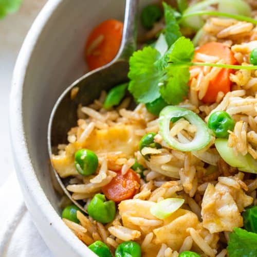 Photo of fried rice recipe in a white bowl.