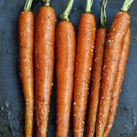 Garlic Roasted Carrots Recipe - Garlic Roasted Carrots recipe make a quick, easy and delicious carrot recipe! The perfect side dish for easy weeknights as well as when entertaining! // addapinch.com