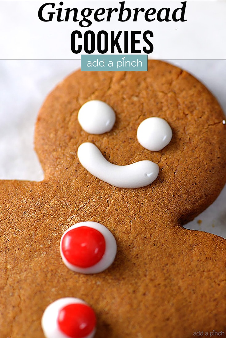 Gingerbread Cookie with eyes, mouth and red candy buttons - with text - addapinch.com
