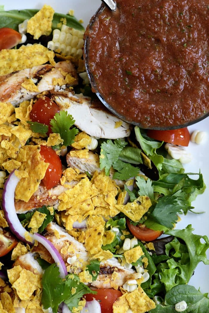 Grilled Chicken Fiesta Salad Recipe - This simple grilled chicken salad recipe is kicked up a notch for a spicy Tex-Mex favorite! // addapinch.com