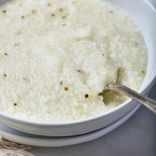 Bowl of southern-style grits in a white bowl.