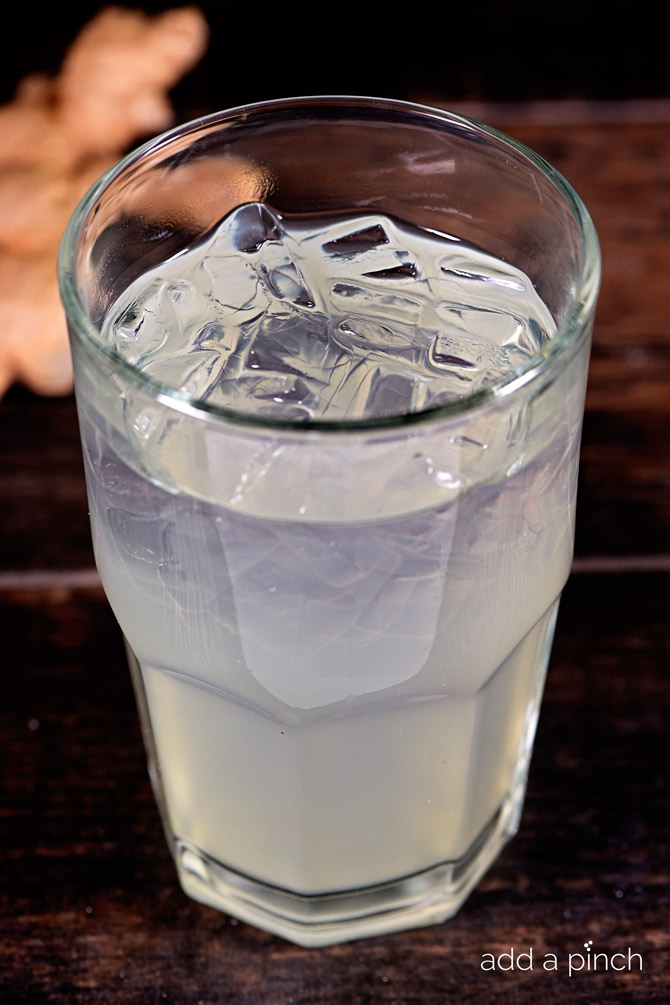 This Homemade Ginger Ale recipe takes a few minutes, but is well worth the time! The flavors of the fresh ginger shine through and make this one glass of ginger ale you won't want to miss! // addapinch.com