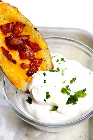 Homemade Potato Skins Recipe - Potato skins make an easy and delicious recipe perfect for parties or game day! // addapinch.com