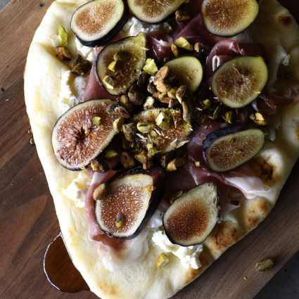 Honeyed Prosciutto Fig Flatbread Recipe - This quick flatbread recipe makes an elegant appetizer recipe that is just as scrumptious as it is beautiful! // addapinch.com