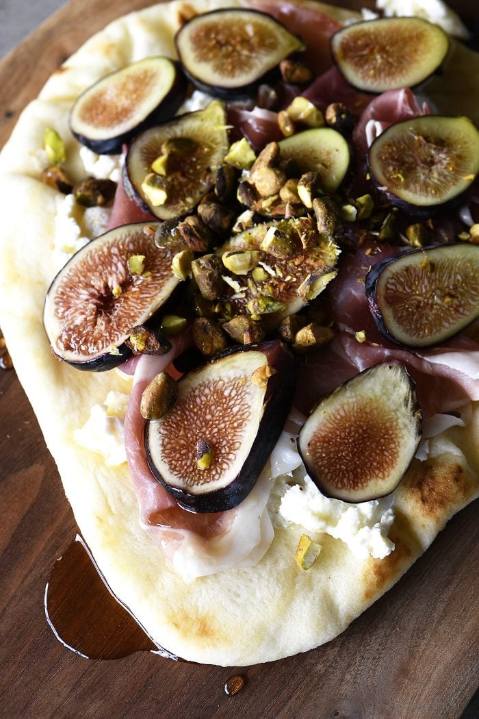 Honeyed Prosciutto Fig Flatbread Recipe - This quick flatbread recipe makes an elegant appetizer recipe that is just as scrumptious as it is beautiful! // addapinch.com