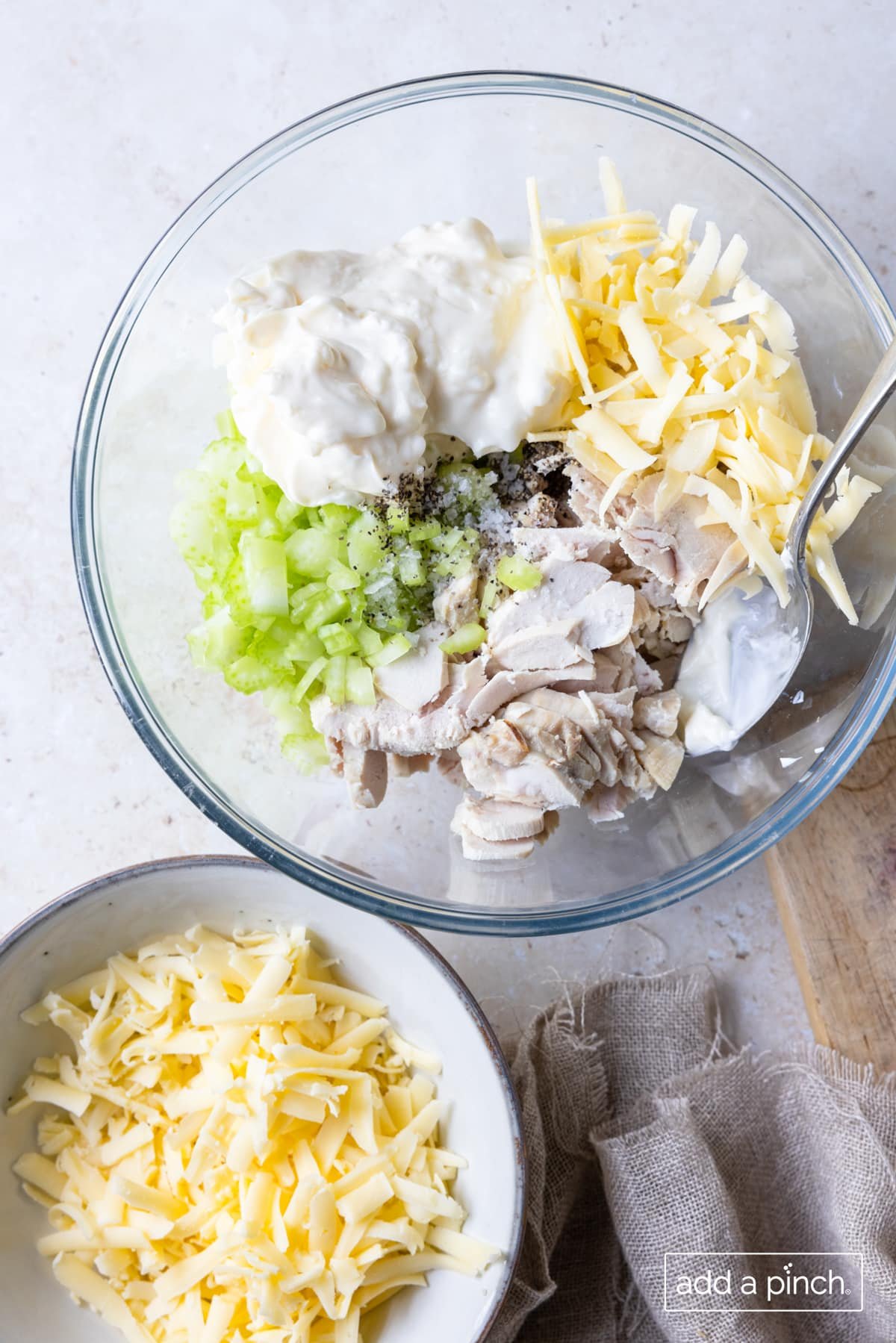 Ingredients for the recipe in a glass mixing bowl on a white counter.
