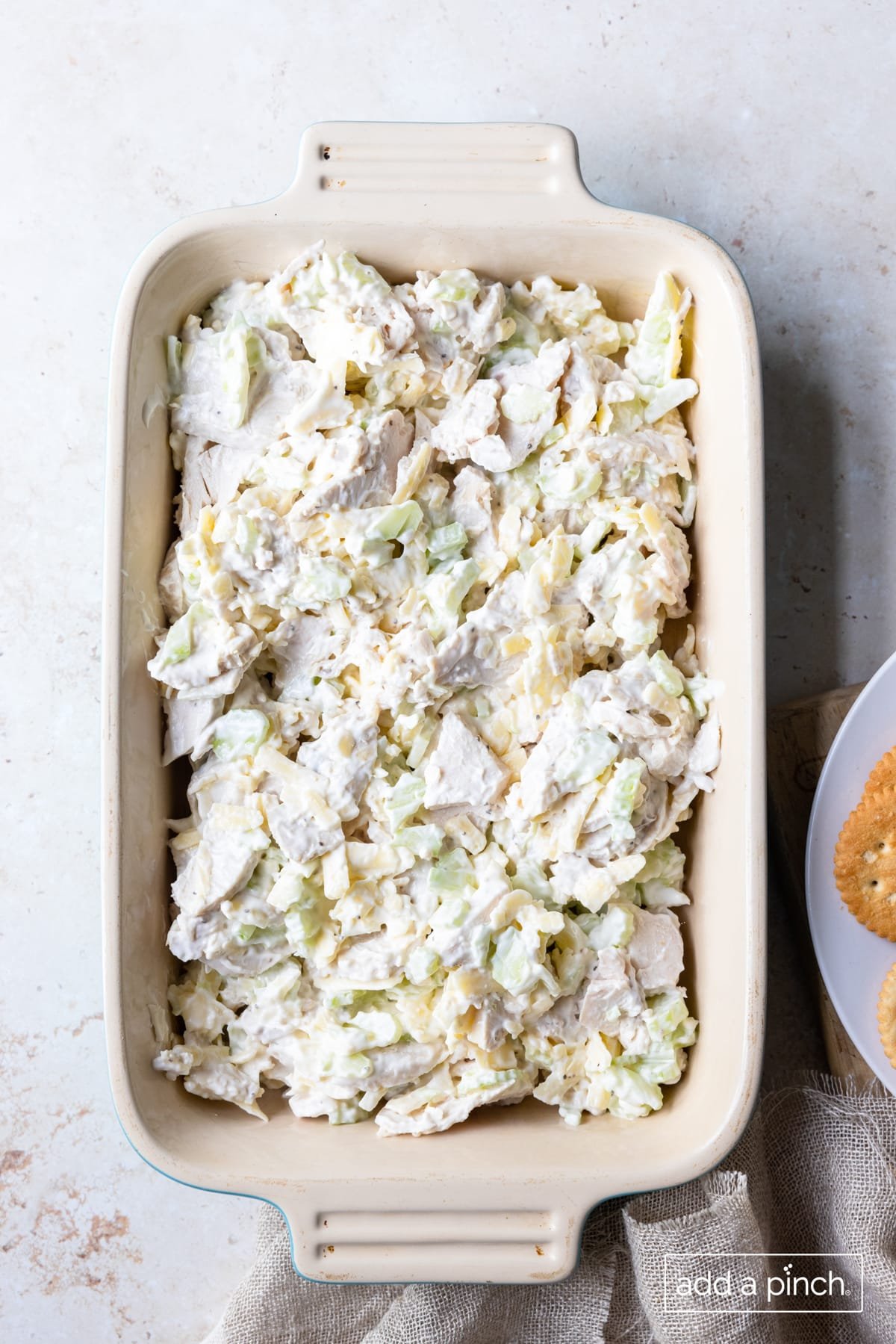 Mixture in a baking dish ready for topping to bake.