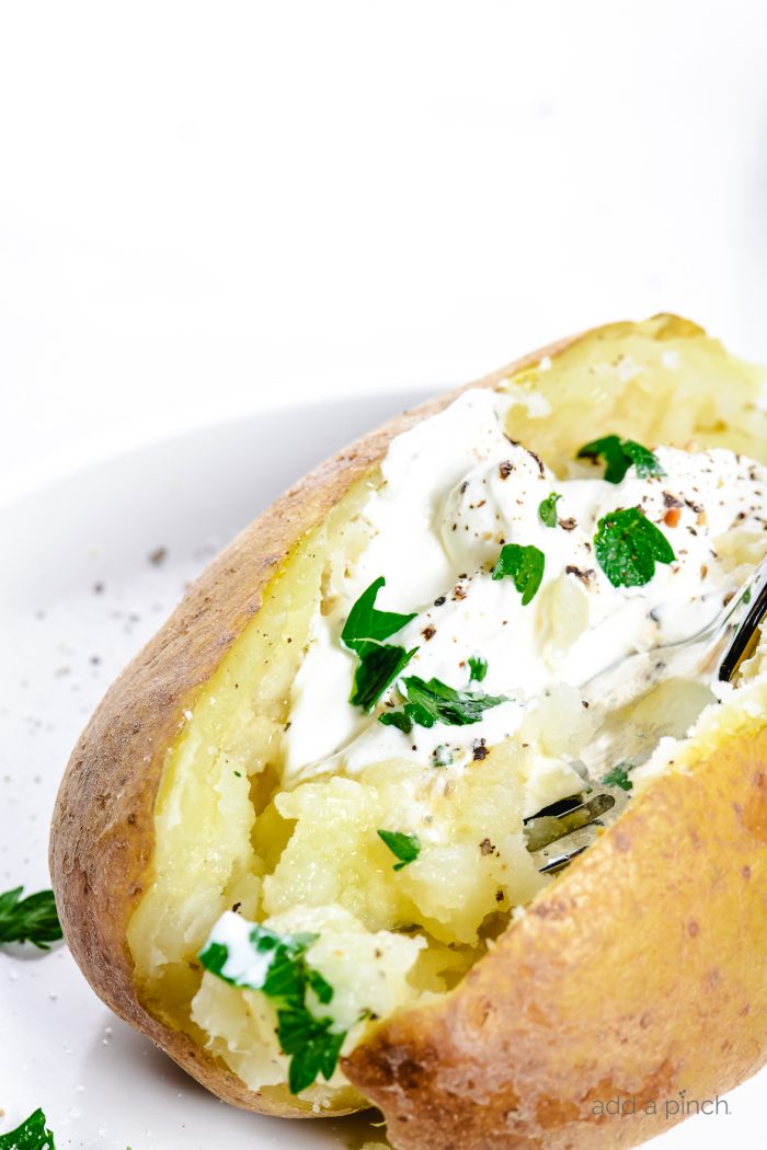 Instant Pot "Baked" Potatoes make a quick and easy way to prepare baked potatoes! Ready in less than 30 minutes! // addapinch.com