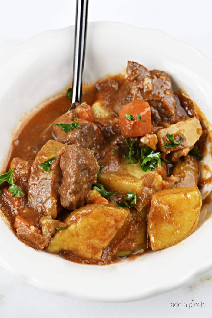 The Best Instant Pot Beef Stew Recipe - Mouthwatering beef stew made with tender chunks of beef, delicious vegetables and a hearty broth makes a favorite Instant Pot recipe! // addapinch.com