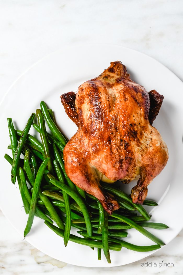 Learn how to make rotisserie chicken in your Instant Pot for tender, mouth-wateringly delicious rotisserie-style chicken every time! // addapinch.com