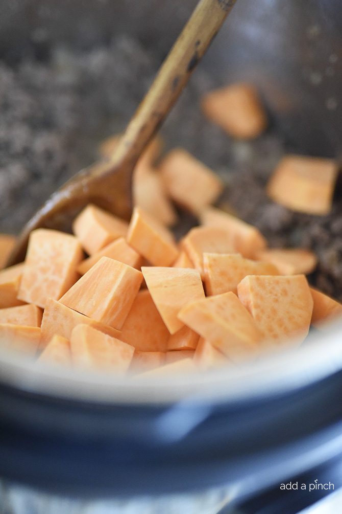 Instant Pot Sweet Potato Chili Recipe - This Instant Pot Sweet Potato Chili makes a hearty, delicious chili recipe in minutes! Made with ground beef, sweet potatoes, and packed with flavor! // addapinch.com