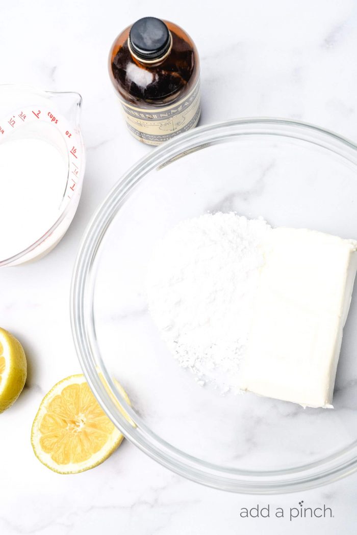 This no bake lemon cream pie is a quick and easy twist on the classic. Made with cream cheese, cream, and lots of lemon with a buttery graham cracker crust. // addapinch.com