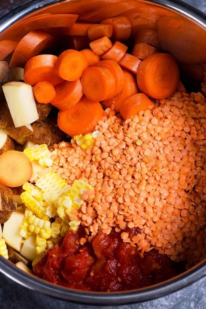 Lentil Vegetable Soup Recipe - This easy one pot Lentil Vegetable Soup recipe is a warm, comforting and delicious soup recipe! Gluten-free, vegetarian and vegan, but one that even meat lovers love! // addapinch.com