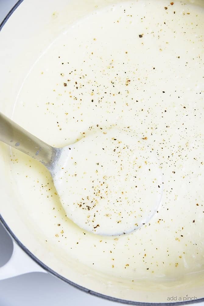 Loaded Baked Potato Soup Recipe - Loaded baked potato soup makes a warm, comforting potato soup recipe. Made with baked potatoes blended into a creamy soup and topped with your potato bar favorites! // addapinch.com