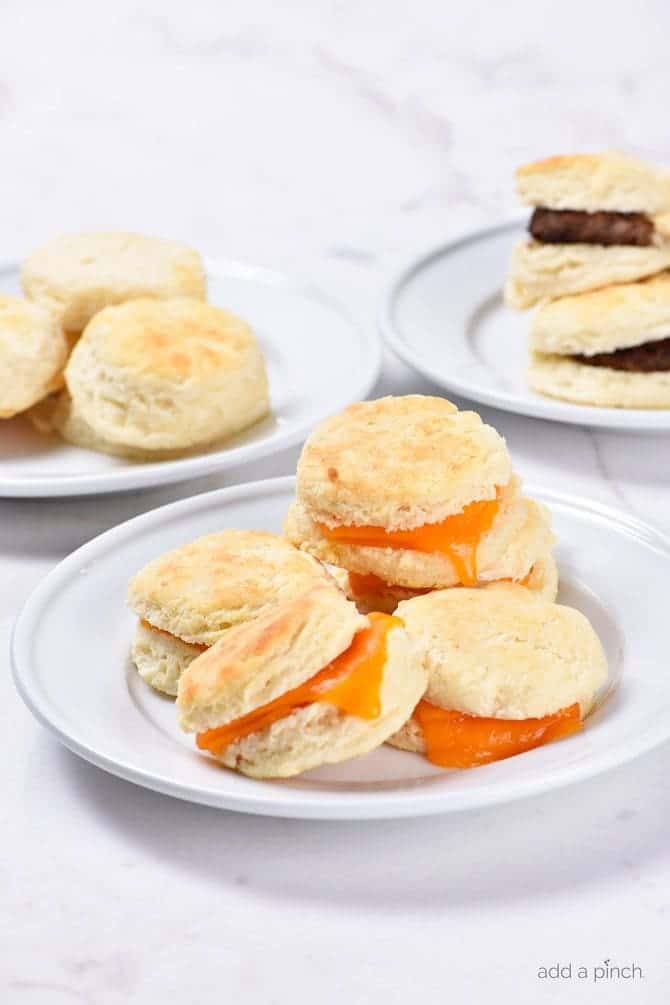 Make Ahead Biscuits Recipe - Make and bake biscuits ahead of time for quick and easy mornings! In less than 30 minutes, you'll have a week's worth of breakfast ready to grab, reheat and go! // addapinch.com