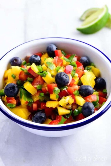 Mango Blueberry Salsa - This Mango Blueberry Salsa makes a fresh fruit salsa recipe perfect for serving with fish, chicken, or on a chip! // addapinch.com